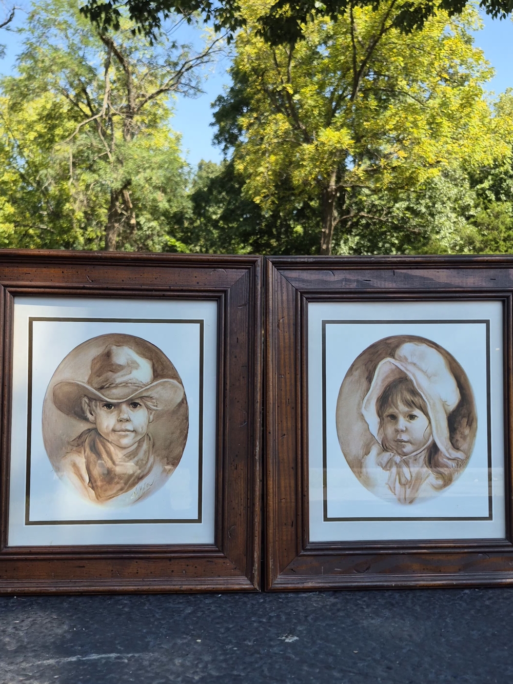 Vintage set of framed "Little Cowboy" and "Prairie Girl"